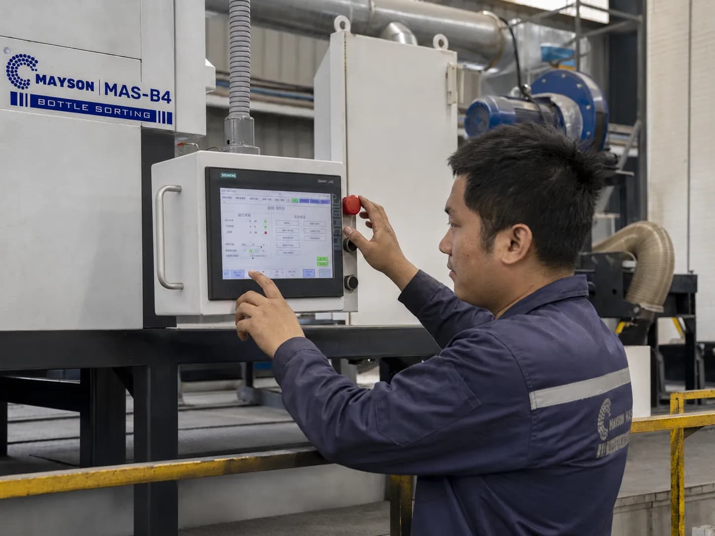 Mayson engineer servicing a sorter control cabinet on site