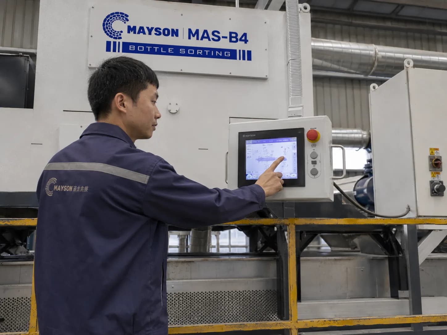 Mayson engineer updating sorter software on the machine HMI